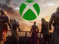 Postacie w zbrojach patrzą na zachód słońca z zielonym logo Xbox.